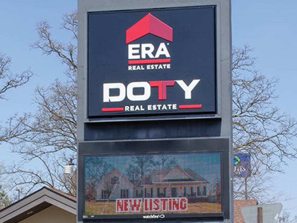 Era Real Estate pylon sign with an LED screen