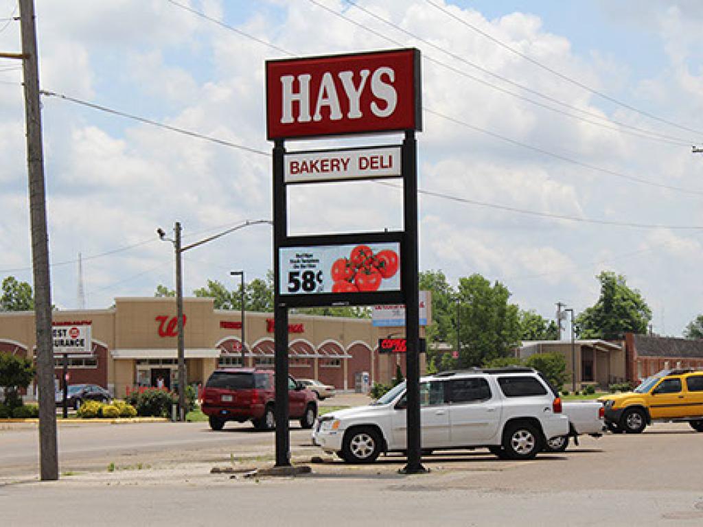 Hay's Bakery and Deli double pole pylon sign with an LED screen