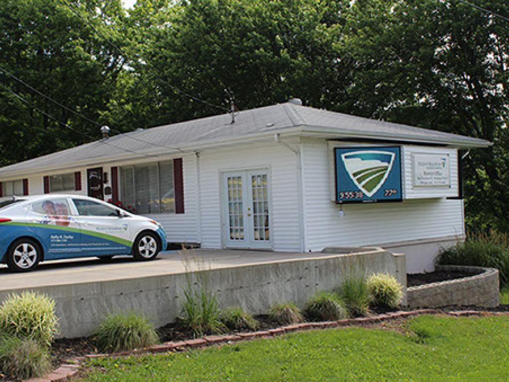 Modern Woodmen LED sign mounted to side of building